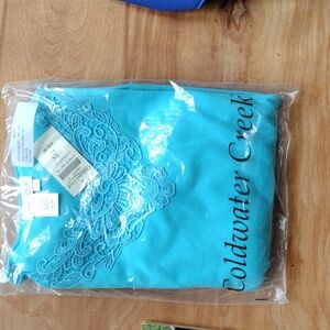 A Coldwater Creek aqua blue t-shirt and shorts set.